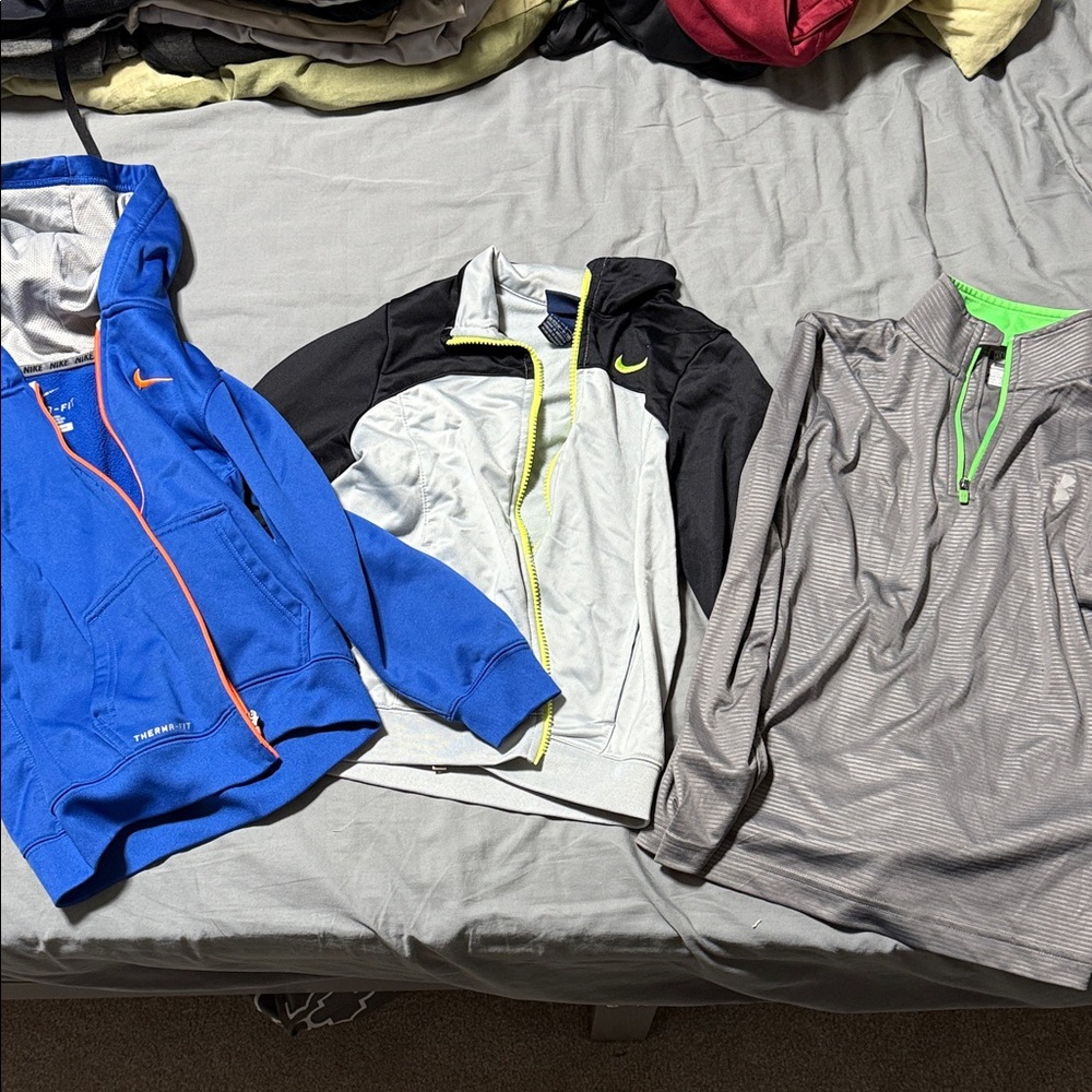 Lot three jackets Nike Men's Blue, Black, and Gray Performance Jackets